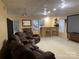 Finished basement with a projector screen, bar area, and plush seating, ideal for entertainment at 2635 Mahogany Ln, Hickory, NC 28602