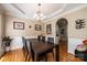 Dining room featuring hardwood floors, coffered ceiling, and an elegant chandelier at 2635 Mahogany Ln, Hickory, NC 28602