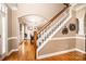 Entryway with hardwood floors and staircase view leading to the dining room at 2635 Mahogany Ln, Hickory, NC 28602