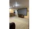 Large screen and bar seating highlight the cozy space, perfect for movie nights and entertaining guests at 2635 Mahogany Ln, Hickory, NC 28602