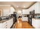 Spacious kitchen featuring granite countertops, stainless steel appliances, and white cabinets at 2635 Mahogany Ln, Hickory, NC 28602