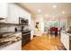 Modern kitchen with white cabinets, granite countertops and stainless steel appliances at 2635 Mahogany Ln, Hickory, NC 28602