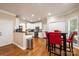 Open kitchen with an eat in dining area and white cabinets at 2635 Mahogany Ln, Hickory, NC 28602