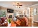 Well-lit living room features hardwood floors, fireplace, stylish decor, and comfortable seating at 2635 Mahogany Ln, Hickory, NC 28602