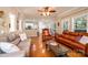 Spacious living room showcasing hardwood floors, sofas, and seamless transition to kitchen and breakfast nook at 2635 Mahogany Ln, Hickory, NC 28602