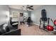 Home office with natural light, carpeting, ceiling fan, and comfortable seating area in neutral tones at 2635 Mahogany Ln, Hickory, NC 28602