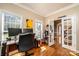 Well-lit office featuring hardwood floors, large windows, and a view into the hallway at 2635 Mahogany Ln, Hickory, NC 28602