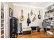 Functional home office with musical instruments, bookshelf, and storage solutions at 2635 Mahogany Ln, Hickory, NC 28602