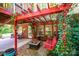 Charming brick patio with a fire pit, swing, and pergola, perfect for outdoor entertaining and relaxation at 2635 Mahogany Ln, Hickory, NC 28602