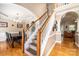 Elegant staircase with wooden handrail and white balusters leading to the second floor at 2635 Mahogany Ln, Hickory, NC 28602