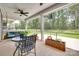 Relaxing screened back porch with outdoor furniture and a view of the green yard at 3018 Trace Meadow Ct # 125, York, SC 29745