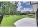 Large backyard with lush green grass and a black fence at 3018 Trace Meadow Ct # 125, York, SC 29745