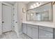 Modern bathroom features white cabinets, countertops, and a large mirror at 3018 Trace Meadow Ct # 125, York, SC 29745