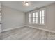 A bright bedroom showcasing modern flooring and shuttered windows at 3018 Trace Meadow Ct # 125, York, SC 29745