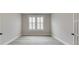 Bright bedroom with shuttered windows and modern gray wood flooring at 3018 Trace Meadow Ct # 125, York, SC 29745