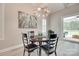 Bright dining area featuring a round table with an elegant chandelier and artwork on the wall at 3018 Trace Meadow Ct # 125, York, SC 29745