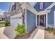 Home's facade showcases stone accents and a welcoming entrance with a decorative wreath at 3018 Trace Meadow Ct # 125, York, SC 29745