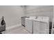 Functional laundry room with modern appliances, a sink, and storage shelves at 3018 Trace Meadow Ct # 125, York, SC 29745
