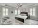 Spacious main bedroom with trey ceilings, neutral colors, large windows and plantation shutters at 3018 Trace Meadow Ct # 125, York, SC 29745