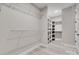 Walk-in closet features ample shelving and hanging space, maximizing organization and storage at 3018 Trace Meadow Ct # 125, York, SC 29745