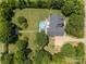 Overhead view of home on a large, well-manicured lot featuring an above ground pool, deck, and mature trees at 315 Talon Dr, Salisbury, NC 28147