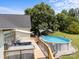 Backyard view featuring the deck, pool, gazebo, and lush greenery at 315 Talon Dr, Salisbury, NC 28147