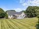 Large backyard features an above ground pool, deck, and manicured lawn, perfect for outdoor activities and relaxation at 315 Talon Dr, Salisbury, NC 28147