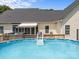 Home's backyard featuring pool, hot tub, and a spacious deck at 315 Talon Dr, Salisbury, NC 28147