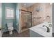 This bathroom includes a walk-in shower, a toilet, and double sinks at 315 Talon Dr, Salisbury, NC 28147
