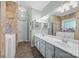 This bathroom includes a dual sink vanity, tile floors, and a walk-in bathtub at 315 Talon Dr, Salisbury, NC 28147