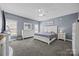 Spacious bedroom features a ceiling fan, two windows, and carpeted floor at 315 Talon Dr, Salisbury, NC 28147