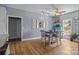 Light-filled dining room with hardwood floors, modern lighting, and a view to the backyard at 315 Talon Dr, Salisbury, NC 28147