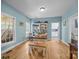 Bright dining room with hardwood floors, a large window, and built-in shelves, perfect for Gathering gatherings at 315 Talon Dr, Salisbury, NC 28147