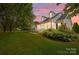 Charming home featuring a covered porch, well-maintained lawn, and lush landscaping, ideal for serene outdoor living at 315 Talon Dr, Salisbury, NC 28147