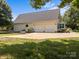 View of the home's exterior showcasing a three-car garage and a spacious driveway at 315 Talon Dr, Salisbury, NC 28147