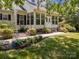 Well-maintained home with a covered porch, lush landscaping, and a welcoming pathway, creating great curb appeal at 315 Talon Dr, Salisbury, NC 28147