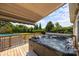 Backyard deck showcasing an outdoor hot tub and a partial view of the above ground pool at 315 Talon Dr, Salisbury, NC 28147