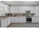 Well-equipped kitchen with white cabinets, stainless steel appliances, and ample counter space at 315 Talon Dr, Salisbury, NC 28147