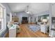 Living room features a stone fireplace, large TV, and hardwood floors with vaulted ceiling and ceiling fan at 315 Talon Dr, Salisbury, NC 28147