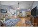 Spacious living room featuring hardwood floors, a stone fireplace, and comfortable seating, great for entertaining at 315 Talon Dr, Salisbury, NC 28147