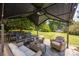 Patio seating area with grill and fan under a shaded pergola at 315 Talon Dr, Salisbury, NC 28147