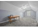 Spacious room with neutral walls, carpeted floor, ceiling fan and a window at 315 Talon Dr, Salisbury, NC 28147