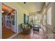 Cozy sunroom featuring wicker furniture, natural light, and wood floors, creating a relaxing retreat at 315 Talon Dr, Salisbury, NC 28147