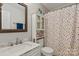 Well-lit bathroom with a framed mirror, and a decorative shower curtain at 317 Sugar Creek Xing, Fort Mill, SC 29715