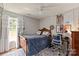 Charming bedroom features a plush bed, desk area, and natural lighting at 317 Sugar Creek Xing, Fort Mill, SC 29715