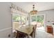 Dining area features rustic table and chairs, with a view of the outdoor patio at 317 Sugar Creek Xing, Fort Mill, SC 29715