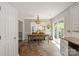 Charming dining area with rustic table and chairs, and sliding door access to the backyard patio at 317 Sugar Creek Xing, Fort Mill, SC 29715