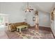 Bright living room features vaulted ceiling, hardwood flooring, and stylish rug at 317 Sugar Creek Xing, Fort Mill, SC 29715