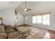 Cozy living room with vaulted ceiling, hardwood flooring, and large windows for natural light at 317 Sugar Creek Xing, Fort Mill, SC 29715