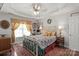 Tranquil bedroom boasts a tray ceiling, large windows, and elegant floral accents at 317 Sugar Creek Xing, Fort Mill, SC 29715